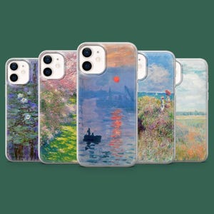 May include: A collection of five phone cases featuring impressionist art. Each case displays a different landscape painting, showcasing a variety of colors and scenes, including water lilies, cherry blossoms, and coastal views. The cases have clear edges.