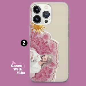 Puede incluir: Una funda transparente para tel&eacute;fono con un dise&ntilde;o de acuarela. El dise&ntilde;o incluye un sol, un cristal rosa y una figura con un cordero. El texto "Cases With Vibe" tambi&eacute;n es visible. El n&uacute;mero "2" est&aacute; en un c&iacute;rculo negro.