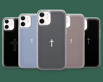 Puede incluir: Una colección de cinco fundas para teléfono en varios colores: negro, azul claro, gris, malva y negro. Cada funda presenta un diseño de cruz blanca. Las fundas están dispuestas en una fila, mostrando las diferentes opciones de color.