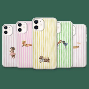 May include: A selection of phone cases with dachshund dog illustrations. Each case has a different design, including a dog in a tutu, sunbathing, and with flowers. The cases have vertical striped backgrounds in various colours.