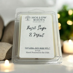 May include: A natural soy wax melt in a clear plastic clamshell. The label reads "Basil Sage & Mint" and "Hand Poured in the USA". The product is 2.4 oz.