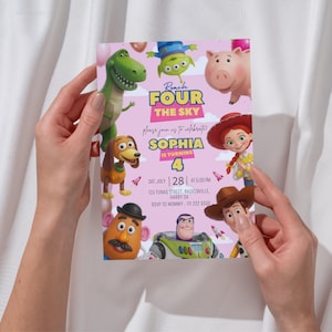 May include: A rectangular birthday invitation card on a light pink background featuring cartoon characters including a green dinosaur, a pig, a cowgirl, a cowboy, a potato figure, a space ranger, and an alien. Text reads Reach FOUR THE SKY, Sophia is turning 4, and event details.