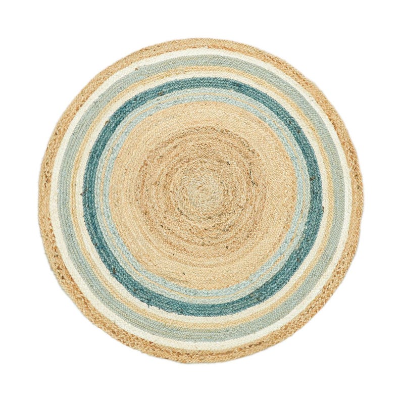 May include: A round, woven area rug featuring a concentric circular pattern. The design consists of a natural tan center surrounded by alternating rings of light blue, white, and a darker teal blue, all crafted from a textured, braided fiber material.