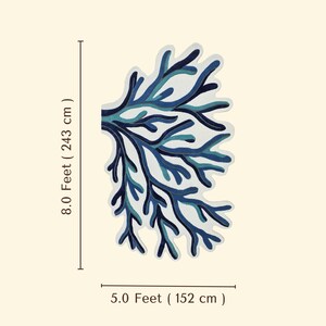 May include: A rug shaped like a coral branch featuring shades of dark blue, light blue, and white. The rug measures 8.0 feet (243 cm) in length and 5.0 feet (152 cm) in width, as indicated by the text and lines displayed next to the object.