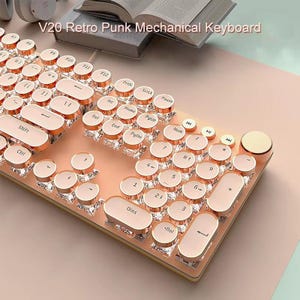 May include: A rose gold and clear mechanical keyboard with round keys. The keyboard has a retro design with the text "V20 Retro Punk Mechanical Keyboard" at the top. The keys are a light pink colour with gold trim.