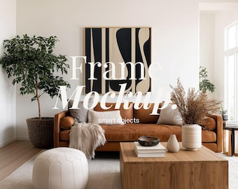 May include: A living room scene featuring a brown leather sofa, a wooden coffee table, and a large abstract painting. The room is decorated with neutral tones, a woven rug, and a potted plant. The text "Frame Mockup" is visible.