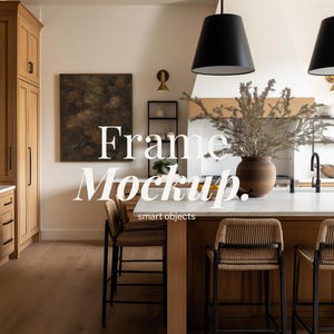 May include: A kitchen interior featuring wooden cabinetry, a marble countertop, and bar stools. A framed artwork is displayed on the wall. The text "Frame Mockup. Smart objects" is overlaid. Two black pendant lights hang from the ceiling.