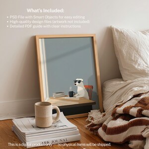 May include: A framed art print featuring a white dog wearing sunglasses, seated at a desk with a coffee cup. A stack of books and a ceramic mug are in the foreground. The text "ARK JOUNAL" is visible on one book. The image is set in a bedroom.