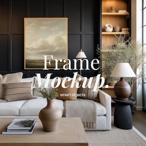 May include: A living room scene featuring a framed landscape painting, a white sofa with decorative pillows, and a wooden coffee table. The text "Frame Mockup. smart objects" is overlaid on the image. A lamp and decorative vase are also visible.