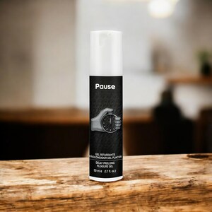 May include: A white and black bottle of "Pause" delay prolong pleasure gel. The bottle has a white top and a black label with the word "Pause" and a graphic of a hand holding a stopwatch. The bottle contains 50 ml (1.7 fl. oz.) of product.