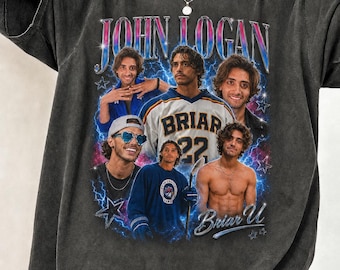 May include: Dark gray t-shirt featuring a collage of images with the text "JOHN LOGAN" in a retro style. The collage includes images of a man in various poses, including one wearing a "BRIAR 22" jersey. The shirt has a vintage, worn look.
