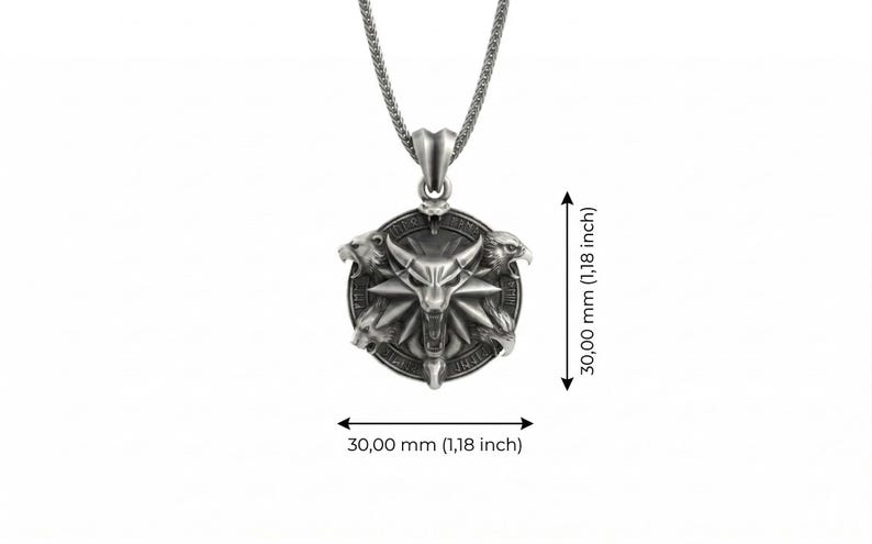 May include: Silver pendant necklace featuring a detailed, circular pendant with a central bull-like figure and three animal heads. The pendant measures 1.18 inches (30.00 mm) in diameter and is suspended from a chain.