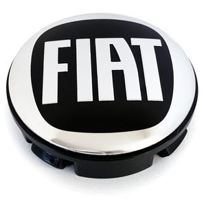 May include: A black and silver Fiat hubcap with the word "FIAT" in white block letters. The hubcap has a circular design with a black center and a silver outer ring. The hubcap is made of plastic and metal.