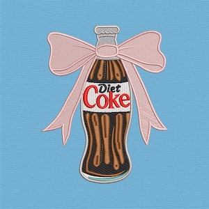 May include: An embroidered Diet Coke bottle with a pink bow on a light blue background. The bottle is brown with the words "Diet Coke" in red and white. The bow is a light pink colour.
