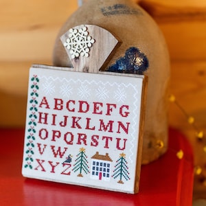 Winter Alphabet mounted on a rustic wood hornbook, Winter, Christmas, finished cross stitch, stitched on evenweave ready to display