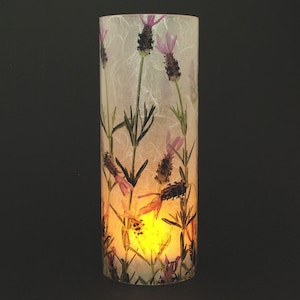 Lavender candle cover.  1 large size with 1 free Electric Tea Light.  Bathroom counter.  Kitchen counter.  Dining table.  LED lighting.