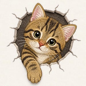 May include: An embroidered patch featuring a brown tabby kitten with large dark eyes and striped fur, appearing to peek through a jagged, circular hole in a light-colored fabric surface, with one paw extended forward through the opening.