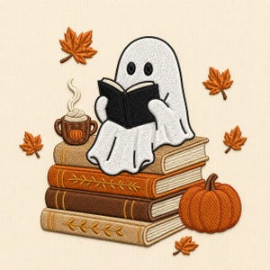 May include: An embroidered design featuring a white ghost reading a black book while sitting on a stack of three books. A brown mug with a pumpkin graphic and steam, a large orange pumpkin, and several scattered orange maple leaves surround it.