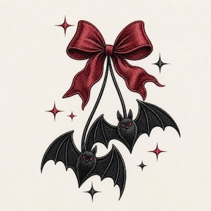 May include: Embroidered design of a dark red bow with two black bats suspended beneath. The bats have red eyes and are surrounded by red and black star accents. The design is set against a cream-coloured background.
