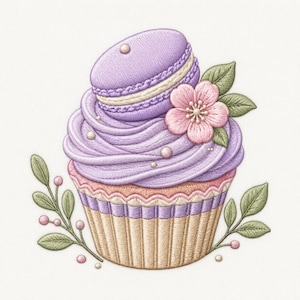 May include: An embroidered cupcake design featuring a lavender macaron topper, swirling purple frosting, and a pink flower accent. The base is tan with vertical stripes, surrounded by green leaves and small pink berries on a white background.