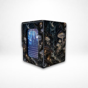May include: A rectangular card storage box featuring a dark, detailed forest illustration with numerous mushrooms, trees, and a crescent moon. A clear window on the front displays a blue trading card with text that reads Pay 1 life, Sacrifice Flooded Strand.