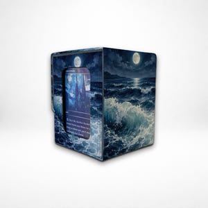 May include: A rectangular deck box featuring a dark blue ocean scene with crashing waves under a full moon. The front panel has a cutout window displaying a portion of a trading card with stained glass artwork and visible game text.