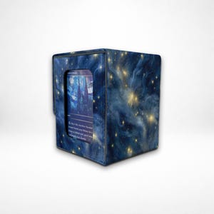 May include: A blue card storage box with a starry night design. The box has a clear window displaying a card with a castle illustration. The box is designed to hold trading cards.