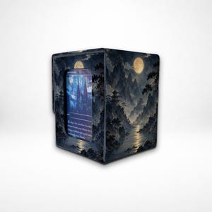 May include: A rectangular deck box featuring a dark, nocturnal landscape illustration with mountains, trees, and a full moon. A central window displays a blue-toned trading card with visible text, including the words Pay 1 life, Sacrifice Flooded Strand.