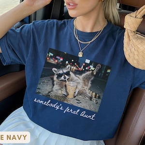 true navy funny aunt shirt with raccoon wearing sunglasses, cool auntie club meme tee, trendy and playful gift for aunt