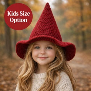 May include: A set of three ceramic mugs with a speckled, cream-colored glaze. Each mug features a different hand-painted design: a blue and green leaf, a yellow and orange flower, and a red and pink berry. The mugs have a simple, rounded shape.