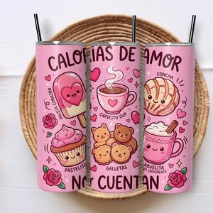 May include: Pink insulated tumblers with black straws, featuring cute illustrations of sweets and drinks. The tumblers have text in Spanish, including "Calorias de Amor" and "No Cuentan". The design includes a popsicle, cupcake, coffee cup, cookies, and hot chocolate.