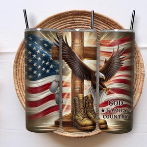 May include: Three stainless steel tumblers with black straws, featuring patriotic designs. The designs include the American flag, an eagle, a cross, military boots, and the text "GOD FAMILY COUNTRY."