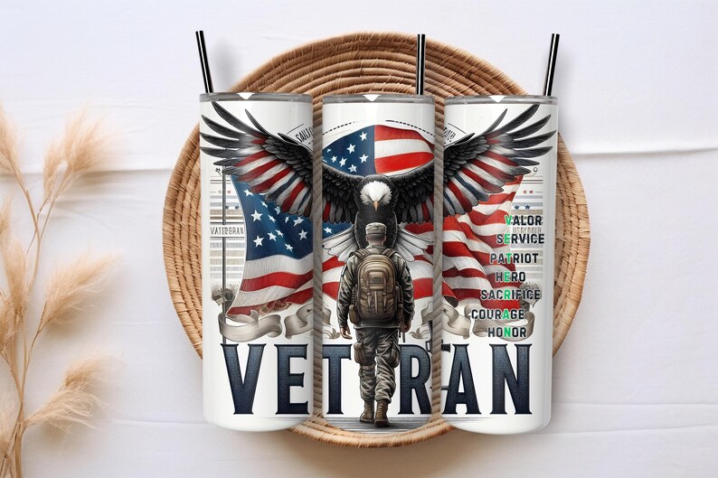 May include: A white tumbler with a black straw, featuring an American flag design with an eagle and a soldier. The word "VETERAN" is prominently displayed. Additional text includes words like "Valor" and "Service".