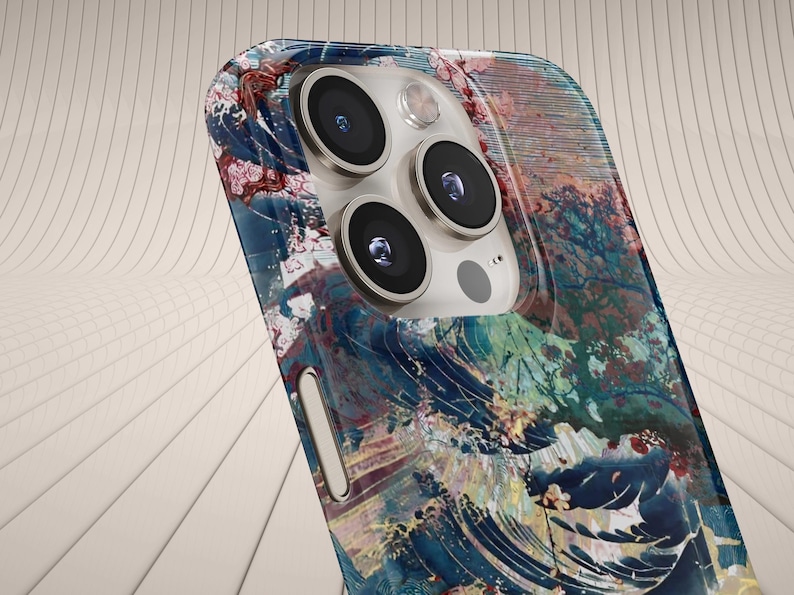 May include: A smartphone case featuring a colorful, artistic design with blue, red, and green hues. The case has a glossy finish and a multi-lens camera system. The design resembles a wave pattern.