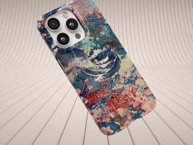 May include: A colorful phone case with a vibrant abstract design. The case features a mix of blue, red, pink, and white hues, creating a painterly effect. The case has a camera cutout with three lenses.