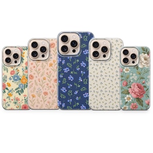 May include: Five floral patterned phone cases. Designs include a variety of flowers in colors such as pink, blue, yellow, and white. The cases have a clear border around the camera.