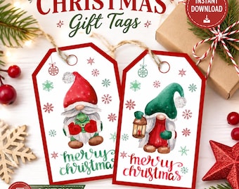 May include: Two rectangular white gift tags with red borders featuring watercolor gnomes. One gnome wears a red hat and holds a small tree; the other wears a green hat and holds a lantern. Both tags include the text Merry Christmas and snowflakes.