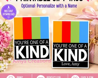 May include: Two rectangular printable gift tags featuring vertical orange, red, green, and blue stripes above a black section with the white text YOU'RE ONE OF A KIND. One tag includes the additional white text Love, Amy at the bottom.