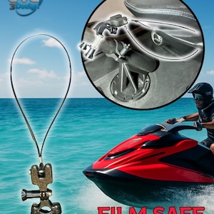 May include: A black and silver camera mount with a black lanyard is displayed against a backdrop of a red and black jet ski on the water. The text "FILM SAFE" is visible. A close-up shows the mount attached to a jet ski.