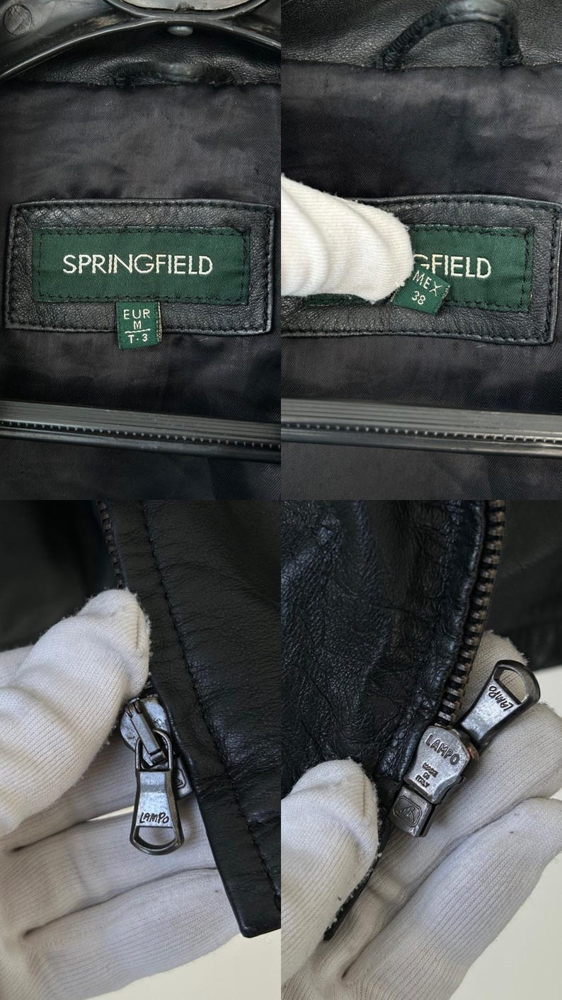 May include: A black leather jacket featuring a green brand label with the text SPRINGFIELD, EUR M, T-3, and MEX 38. The jacket includes a metal zipper pull engraved with the text LAMPO and MADE IN ITALY, showcasing the brand details and hardware.
