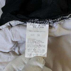 Puede incluir: Primer plano de una etiqueta de prenda. La etiqueta dice "FABRIQUE AU JAPON MADE IN JAPAN" y "100% COTON COTTON". La talla es 36. Tambi&eacute;n se imprimen instrucciones de lavado. La etiqueta es blanca con texto negro.