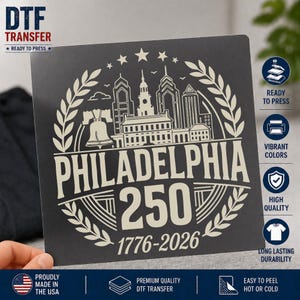 May include: A black DTF transfer featuring a cream-colored design of the Philadelphia skyline, the Liberty Bell, and the text "PHILADELPHIA 250 1776-2026". The transfer is ready to press and proudly made in the USA.
