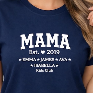 May include: Navy blue t-shirt with the word "MAMA" in large white letters. Below the word "MAMA" is "Est. ♥ 2019" and the names Emma, James, Ava, and Isabella. The words "Kids Club" are at the bottom.