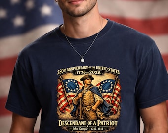 May include: A navy blue t-shirt featuring a graphic of a colonial soldier standing between two American flags. The text reads 250TH ANNIVERSARY OF THE UNITED STATES 1776-2026 DESCENDANT OF A PATRIOT and John Sample 1745-1813 in a vintage style.