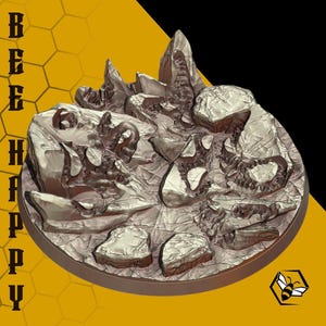 May include: A detailed, metallic-looking sculpture of a rocky landscape with sharp peaks and textured surfaces. The sculpture is circular and features the text "BEE HAPPY" vertically along the left side. A yellow and black background with a honeycomb pattern and a bee logo.