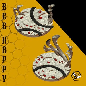 May include: Two decorative, circular objects with a textured, off-white surface, adorned with red accents and dark bands. Each has stylized, branch-like elements. The background is yellow with a honeycomb pattern and the text "BEE HAPPY".