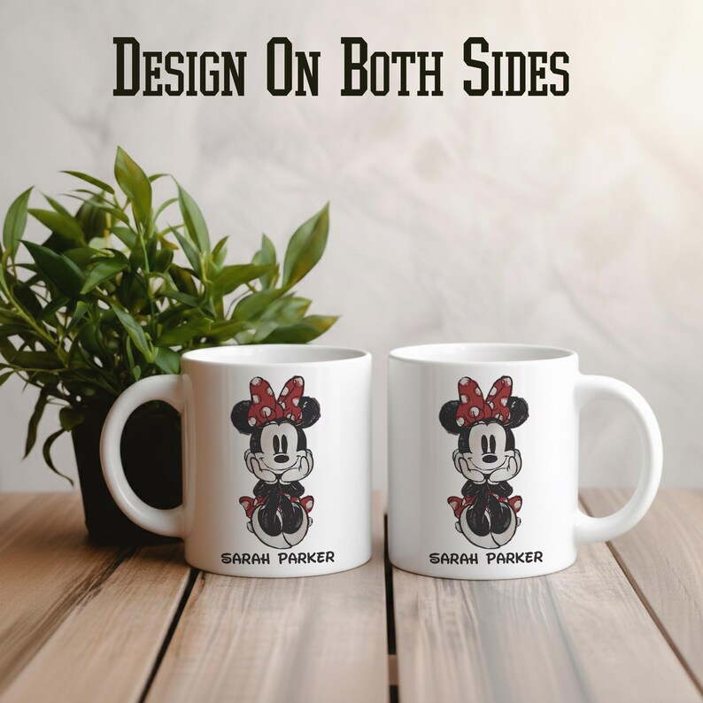 May include: Two white ceramic mugs with a Minnie Mouse design, featuring a red polka dot bow and black dress. The text "SARAH PARKER" is printed below the character. The text "DESIGN ON BOTH SIDES" is printed above the mugs.