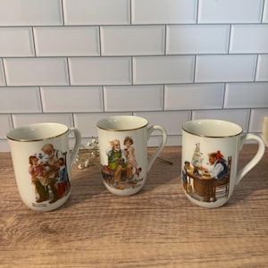 Vintage Norman Rockwell mugs. 3- The Cobbler, For A Good Boy & The Toymaker 1982