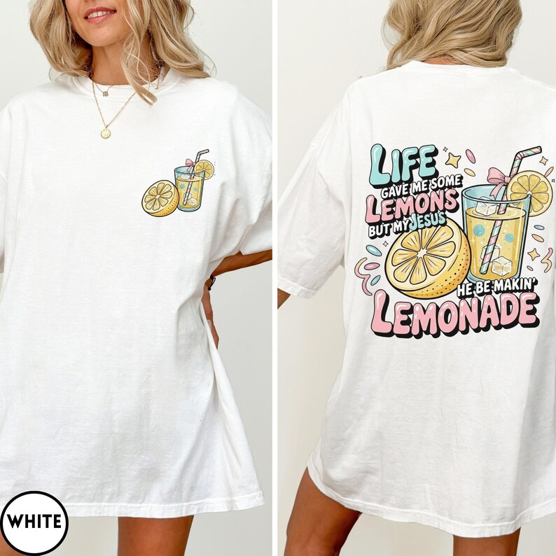 May include: White t-shirt with a colorful lemonade graphic on the front and back. The front features a lemon and a glass of lemonade. The back says "Life gave me some lemons but my Jesus he be makin' lemonade."