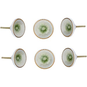 May include: Six white ceramic cabinet knobs with a green floral design in the center and a gold rim. The knobs have a brass screw for installation. The knobs are arranged in two rows of three against a white background.